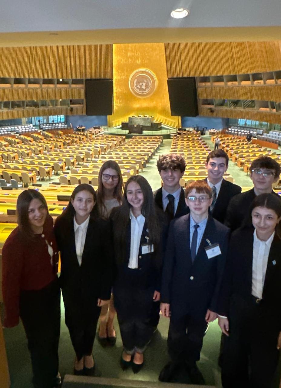 Max with fellow Model UN delegates in the United Nations General Assembly hall