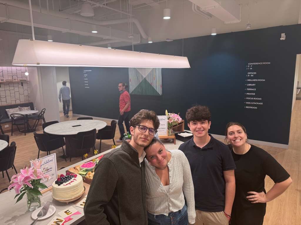 Max with three Revinova colleagues in the office
